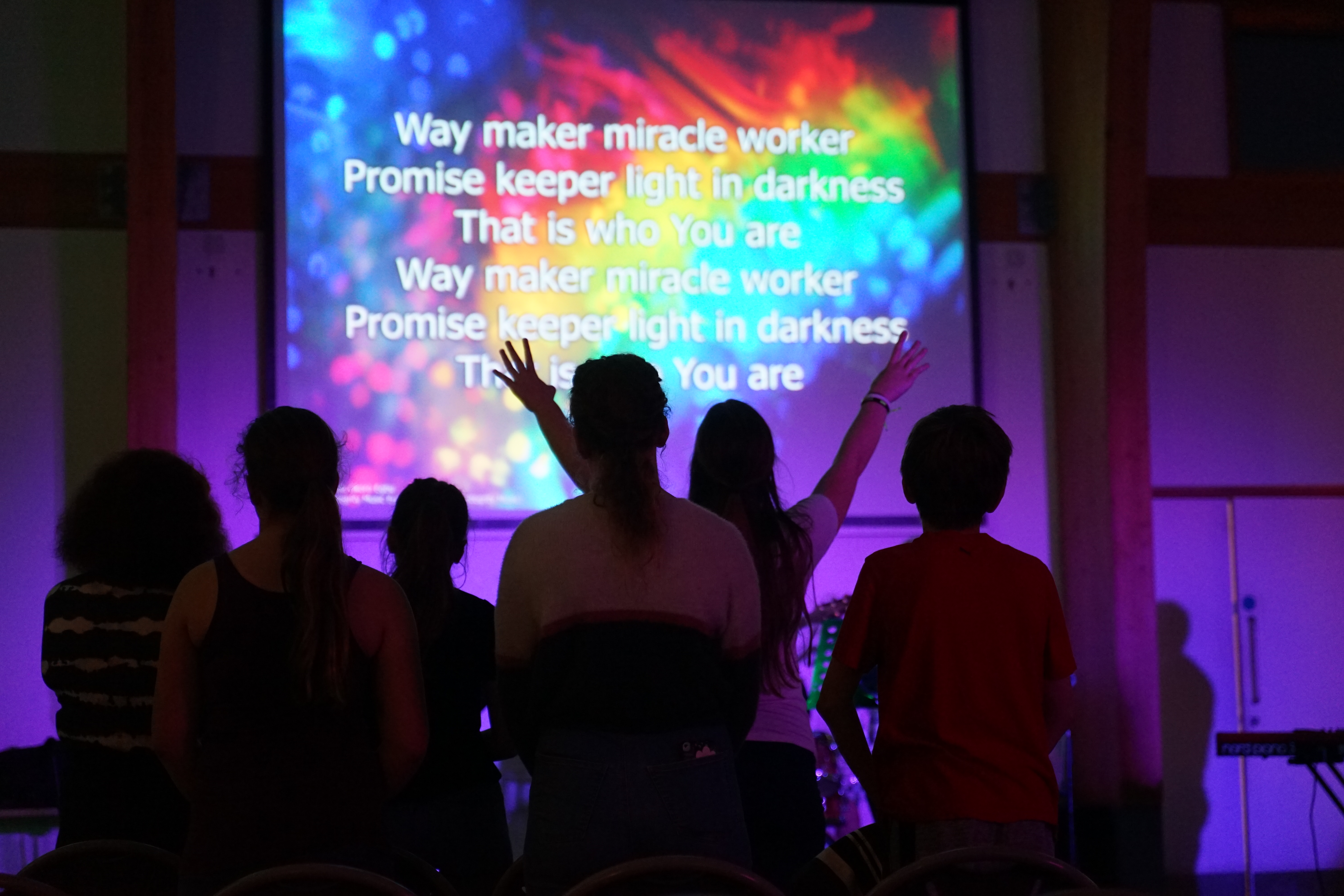 Young people worshipping